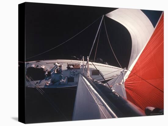 Red Topped Spinnaker Bellying Out from Nefertiti's Towering Mast During America's Cup Trials-George Silk-Stretched Canvas