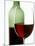 Red Wine Glass with Half-Full Wine Bottle in Background-Joerg Lehmann-Mounted Photographic Print