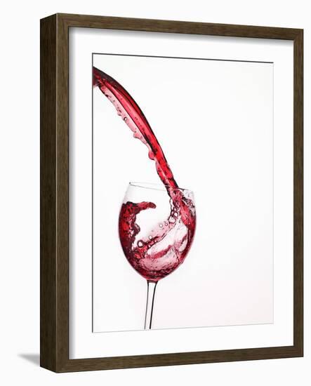 Red Wine Pouring into a Glass from Bottle-null-Framed Photographic Print