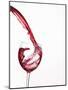 Red Wine Pouring into a Glass from Bottle-null-Mounted Photographic Print