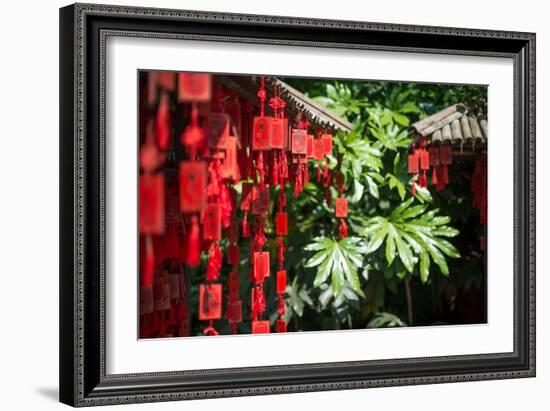 Red Wooden Buddhist Good Luck Charms and Tropical Vegetation, Hangzhou, Zhejiang, China-Andreas Brandl-Framed Photographic Print