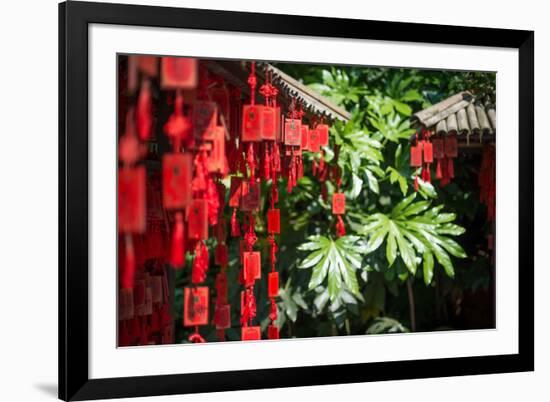 Red Wooden Buddhist Good Luck Charms and Tropical Vegetation, Hangzhou, Zhejiang, China-Andreas Brandl-Framed Photographic Print