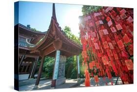 Red Wooden Traditional Chinese Good Luck Charms and Pagoda in Background, Hangzhou, Zhejiang, China-Andreas Brandl-Stretched Canvas