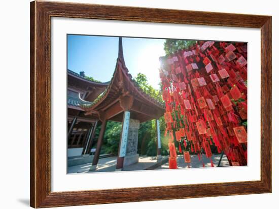 Red Wooden Traditional Chinese Good Luck Charms and Pagoda in Background, Hangzhou, Zhejiang, China-Andreas Brandl-Framed Photographic Print