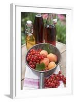 Redcurrants and Apricots in Pan in Front of Bottles of Juice-Eising Studio - Food Photo and Video-Framed Photographic Print