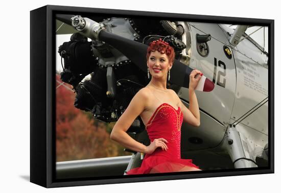 Redhead Pin-Up Girl in 1940's Style Dancer Attire Holding on to a Vintage Aircraft Propeller-null-Framed Stretched Canvas