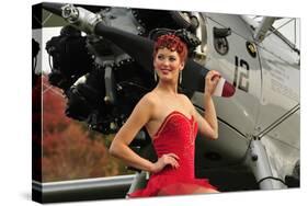 Redhead Pin-Up Girl in 1940's Style Dancer Attire Holding on to a Vintage Aircraft Propeller-null-Stretched Canvas