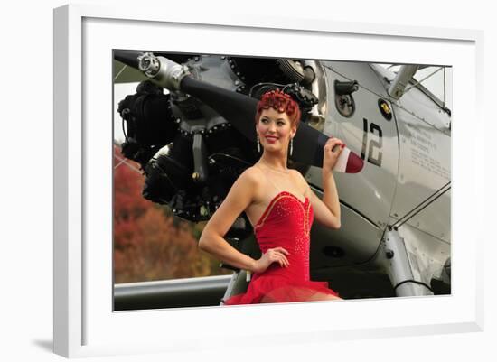 Redhead Pin-Up Girl in 1940's Style Dancer Attire Holding on to a Vintage Aircraft Propeller-null-Framed Photographic Print