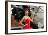 Redhead Pin-Up Girl in 1940's Style Dancer Attire Holding on to a Vintage Aircraft Propeller-null-Framed Photographic Print