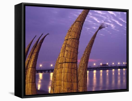 Reed Boats are Stacked Along the Beach at the Fishing Village of Huanchaco in Northern Peru-Andrew Watson-Framed Stretched Canvas