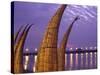 Reed Boats are Stacked Along the Beach at the Fishing Village of Huanchaco in Northern Peru-Andrew Watson-Stretched Canvas