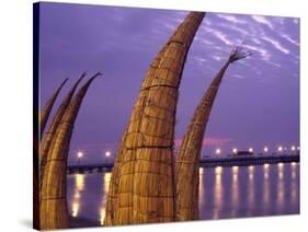 Reed Boats are Stacked Along the Beach at the Fishing Village of Huanchaco in Northern Peru-Andrew Watson-Stretched Canvas