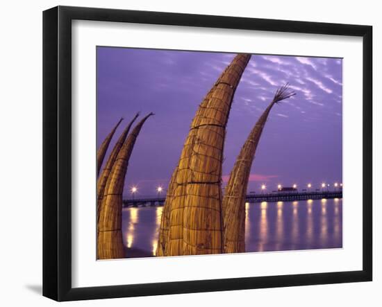 Reed Boats are Stacked Along the Beach at the Fishing Village of Huanchaco in Northern Peru-Andrew Watson-Framed Photographic Print