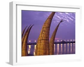 Reed Boats are Stacked Along the Beach at the Fishing Village of Huanchaco in Northern Peru-Andrew Watson-Framed Photographic Print