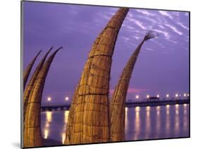 Reed Boats are Stacked Along the Beach at the Fishing Village of Huanchaco in Northern Peru-Andrew Watson-Mounted Photographic Print