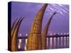 Reed Boats are Stacked Along the Beach at the Fishing Village of Huanchaco in Northern Peru-Andrew Watson-Stretched Canvas