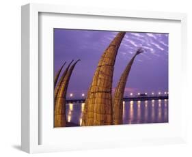 Reed Boats are Stacked Along the Beach at the Fishing Village of Huanchaco in Northern Peru-Andrew Watson-Framed Photographic Print