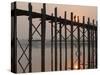 Reflection in Water and Buddhist Monk Silhouetted at Sunrise Crossing U Bein Teak Bridge-Stephen Studd-Stretched Canvas