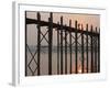 Reflection in Water and Buddhist Monk Silhouetted at Sunrise Crossing U Bein Teak Bridge-Stephen Studd-Framed Photographic Print