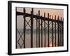 Reflection in Water and Buddhist Monk Silhouetted at Sunrise Crossing U Bein Teak Bridge-Stephen Studd-Framed Photographic Print