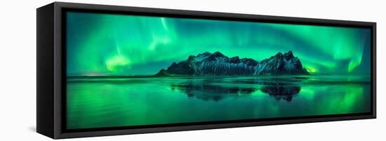 Reflection of Aurora Borealis in the sea with Vestrahorn mountains in center, Stokksnes Beach, S...-null-Framed Stretched Canvas