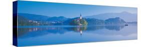 Reflection of Mountains and Buildings in Water, Lake Bled, Slovenia-null-Stretched Canvas