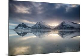 Reflection of mountains on ocean at sunset in Vatnajokull National Park in eastern Iceland-Alex Saberi-Mounted Photographic Print