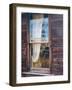 Reflection of the windmill and tractor in the window of an old building in ghost town.-Julie Eggers-Framed Photographic Print