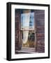 Reflection of the windmill and tractor in the window of an old building in ghost town.-Julie Eggers-Framed Photographic Print