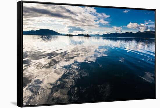 Reflections in the calm waters of the Inside Passage, Southeast Alaska, USA-Mark A Johnson-Framed Stretched Canvas