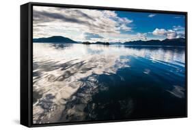 Reflections in the calm waters of the Inside Passage, Southeast Alaska, USA-Mark A Johnson-Framed Stretched Canvas