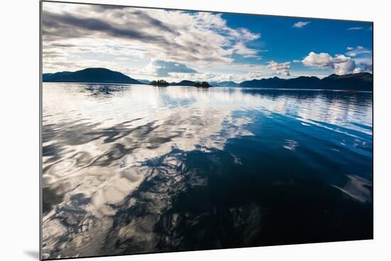 Reflections in the calm waters of the Inside Passage, Southeast Alaska, USA-Mark A Johnson-Mounted Photographic Print