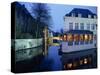 Reflections in the Canals of Restaurant and Bridge, Illuminated in the Evening, in Bruges, Belgium-Pate Jenny-Stretched Canvas