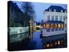 Reflections in the Canals of Restaurant and Bridge, Illuminated in the Evening, in Bruges, Belgium-Pate Jenny-Stretched Canvas