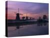 Reflections of a Line of Windmills in a Misty Landscape at Kinderdjik, Holland-Gavin Hellier-Stretched Canvas