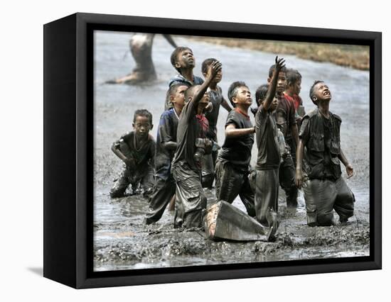 Refugee Children Try to Catch Relief Goods Tossed from an Australian Military Helicopter-null-Framed Stretched Canvas