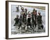 Refugee Children Try to Catch Relief Goods Tossed from an Australian Military Helicopter-null-Framed Photographic Print