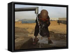 Refugee Washes His Face in a Refugee Camp in the Outskirts of Kabul, Afghanistan-null-Framed Stretched Canvas