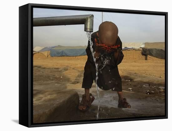 Refugee Washes His Face in a Refugee Camp in the Outskirts of Kabul, Afghanistan-null-Framed Stretched Canvas