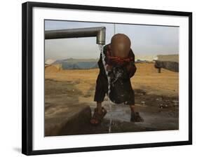 Refugee Washes His Face in a Refugee Camp in the Outskirts of Kabul, Afghanistan-null-Framed Photographic Print