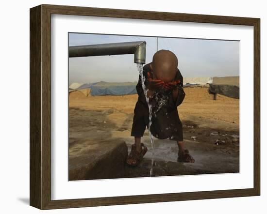 Refugee Washes His Face in a Refugee Camp in the Outskirts of Kabul, Afghanistan-null-Framed Photographic Print