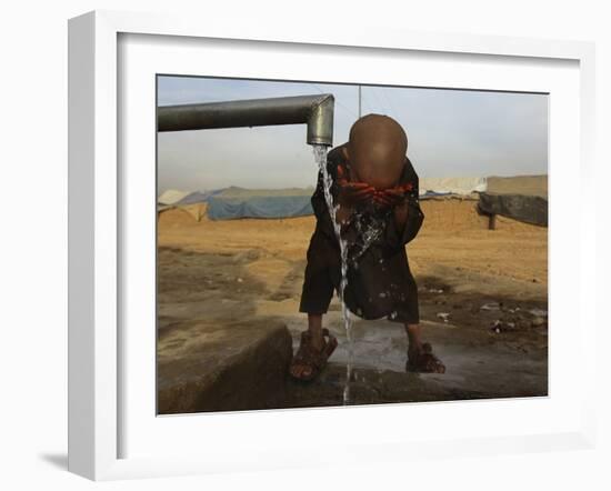 Refugee Washes His Face in a Refugee Camp in the Outskirts of Kabul, Afghanistan-null-Framed Photographic Print