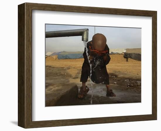 Refugee Washes His Face in a Refugee Camp in the Outskirts of Kabul, Afghanistan-null-Framed Photographic Print