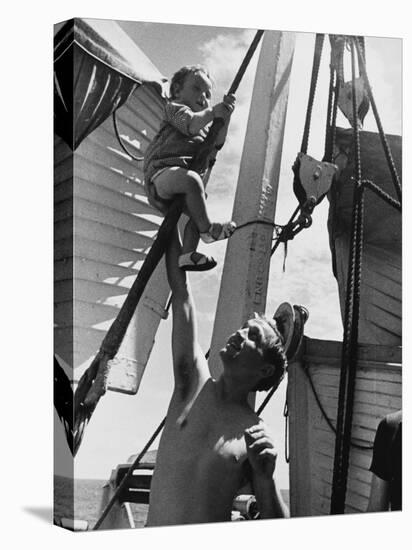 Refugees on a Ship, with Child Playing in the Rigging During World War Ii-Robert Hunt-Stretched Canvas