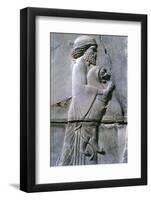 Relief of a man holding a lion cub, Persepolis, Iran-Vivienne Sharp-Framed Photographic Print