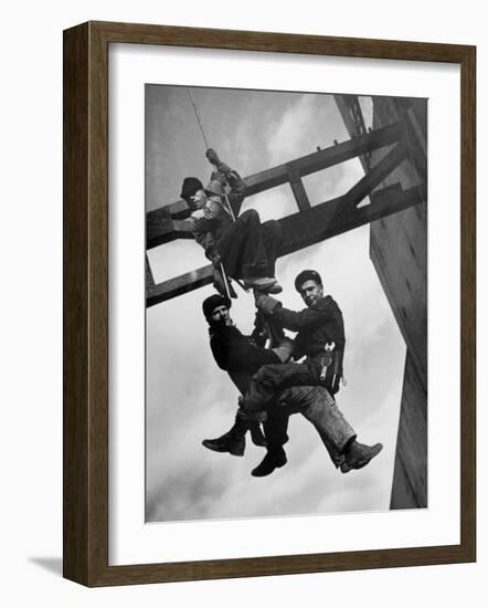 Relief Workers Hanging from Cable in Front of a Giant Beam During the Construction of Fort Peck Dam-Margaret Bourke-White-Framed Photographic Print