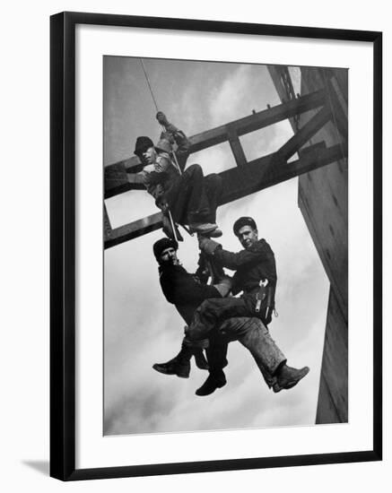 Relief Workers Hanging from Cable in Front of a Giant Beam During the Construction of Fort Peck Dam-Margaret Bourke-White-Framed Photographic Print