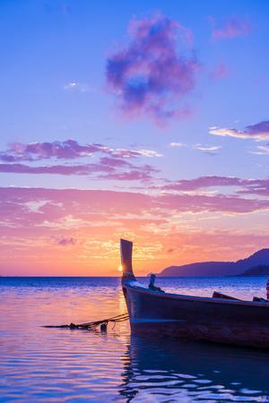 Beautiful Sunrise in Rawai Phuket Island Thailand with Long Tailed Boat Ruea Hang Yao