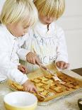 Two Children Brushing Biscuits with Glace Icing-Renate Forster-Stretched Canvas