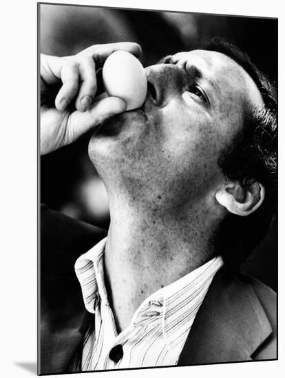 Renzo Arbore Drinking a Fresh Egg-null-Mounted Photographic Print
